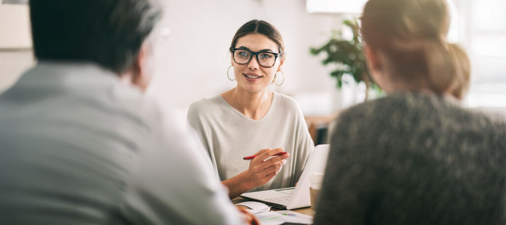 Woman interviewing couple