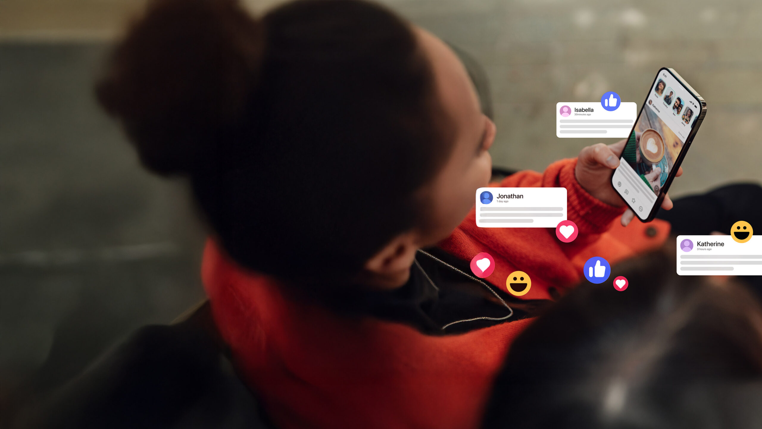 Woman holding phone with social bubble popups