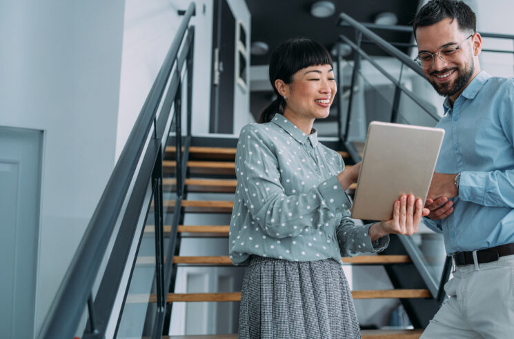 Co-workers meeting on stairs