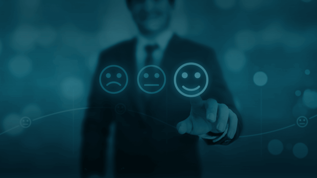 Man reaching out to touch smiley-face sentiment icon