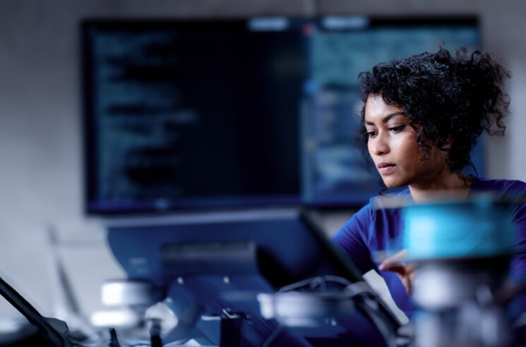 AI generated image of woman in IT computing lab