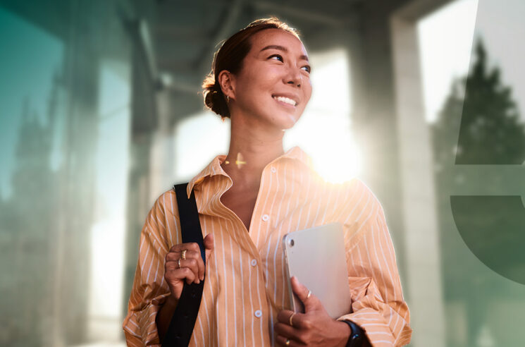Woman with shoulder bag and laptop