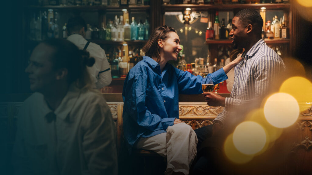 Couple enjoying drinks at a bar.